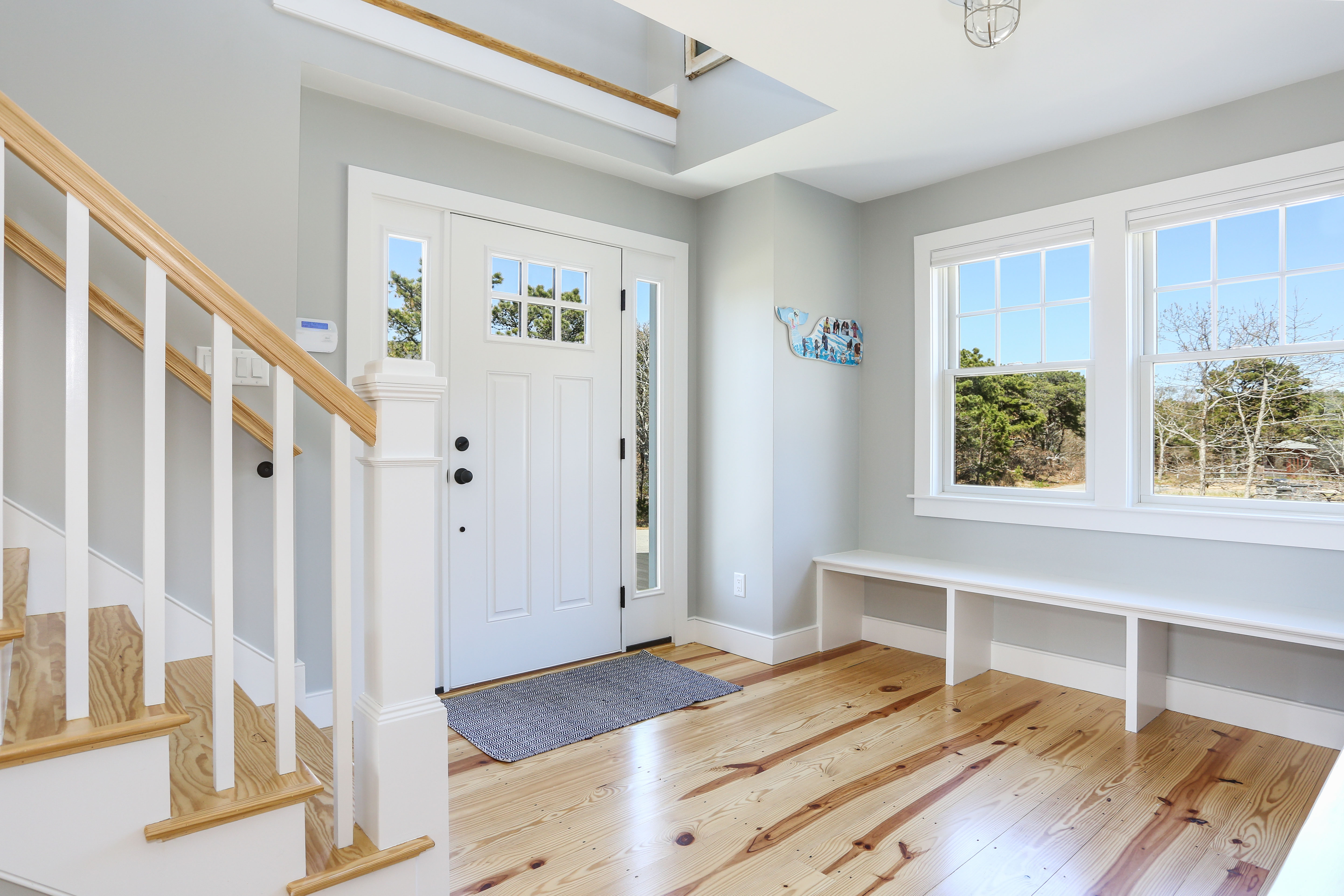 Entry foyer with bench cape cod by REEF 